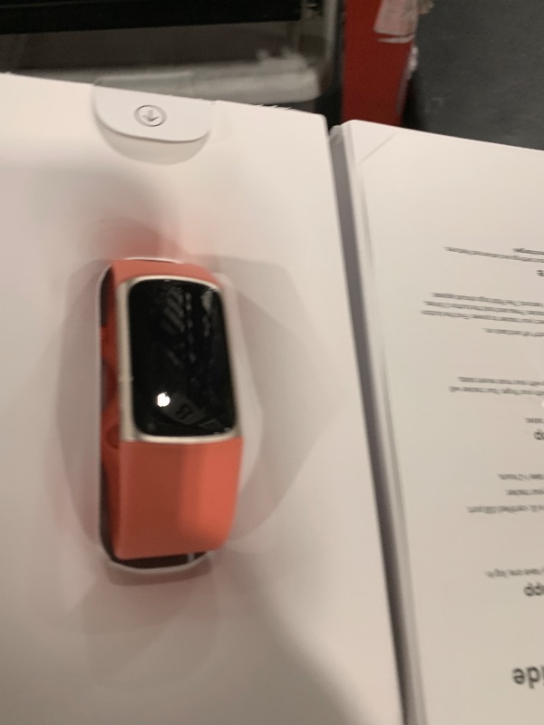 Photo 1 of Fitbit Charge 6 Fitness Tracker with Google apps, Heart Rate on Exercise Equipment, 6-Months Premium Membership Included, GPS, Health Tools and More, Gold/Coral, One Size (S & L Bands Included)