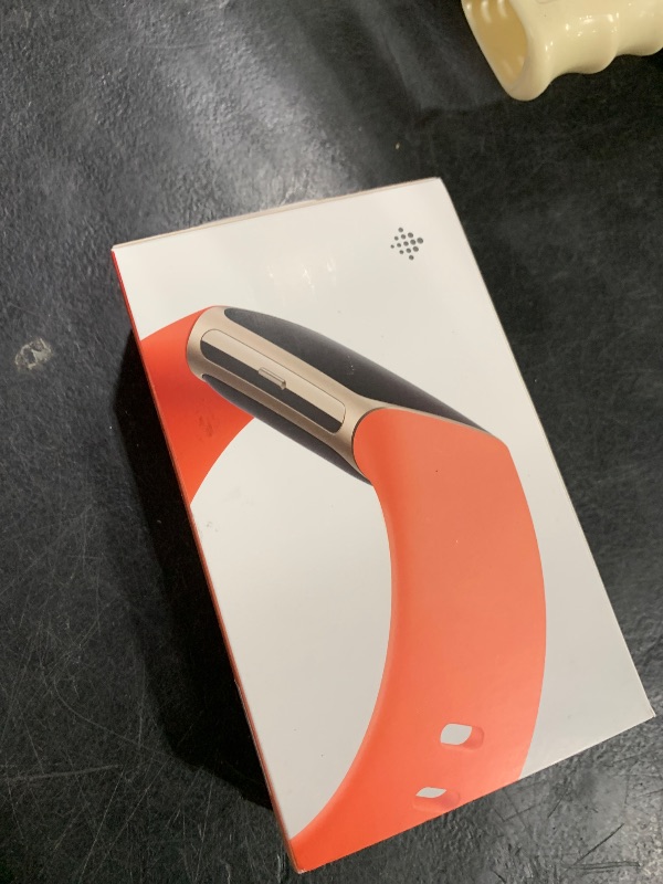 Photo 1 of Fitbit Charge 6 Fitness Tracker with Google apps, Heart Rate on Exercise Equipment, 6-Months Premium Membership Included, GPS, Health Tools and More, Gold/Coral, One Size (S & L Bands Included)