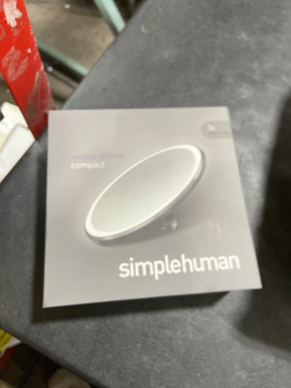 Photo 1 of simplehuman Sensor Mirror, Lighted Compact Makeup Magnifying Mirror with Light, Round, Travel Size, Black Stainless Steel