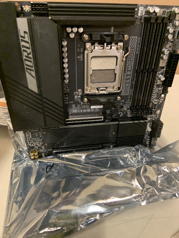 Photo 1 of GIGABYTE B650M AORUS Elite AX AMD AM5 mATX Motherboard, Support Ryzen 9000/8000/7000 Series, DDR5, 12+2+2 Power Phase, PCIe 5.0 M.2, USB-C 3.2 Gen 2, WIFI6E, 2.5GbE, EZ-Latch, Q-Flash, RGB Fusion