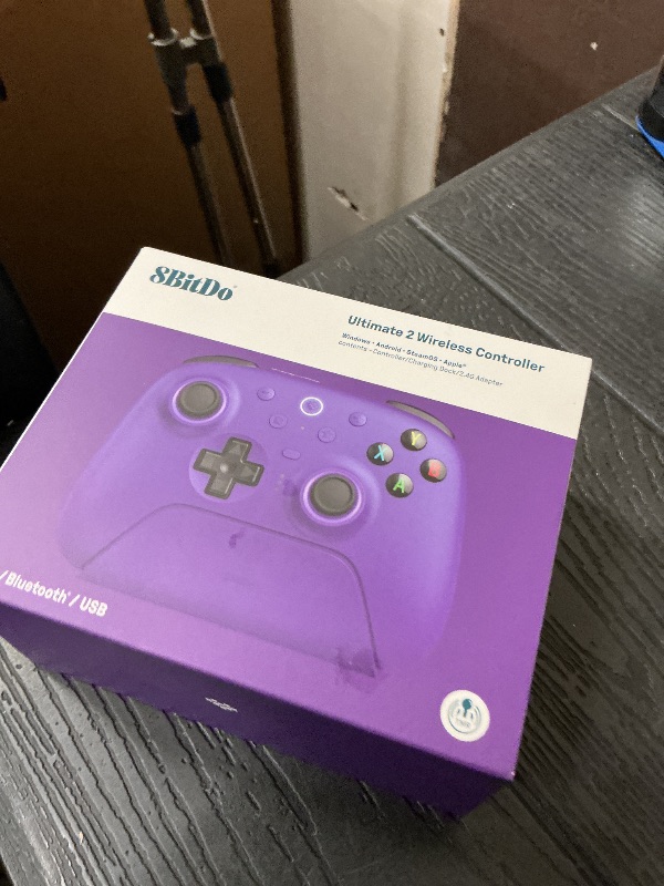 Photo 1 of 8Bitdo Ultimate 2 Wireless Gaming Controller with TMR Joysticks, Switchable Hall Effect/Tactile Triggers, 8Speed Wireless Tech, Charging Dock, RGB Fire Ring for PC & Android - Purper