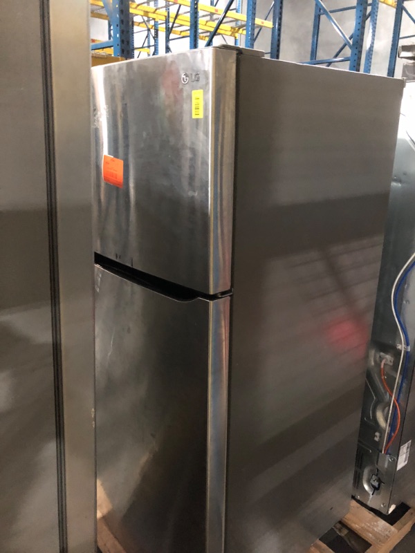 View 2 of ***MAJOR DAMAGE HEAVILY USED TRUCK OR TRIALER PICKUP ONLY***
30 in. 20 cu. ft. Top Freezer Refrigerator in Stainless Steel, Energy Star, Garage Ready