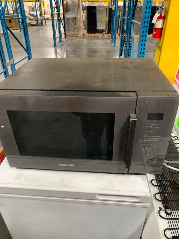 Photo 1 of ***HEAVILY USED***
SAMSUNG 1.9 cu. ft. Countertop Microwave with Sensor Cooking, Matte Black Stainless Steel, MS19DG8500MTAA