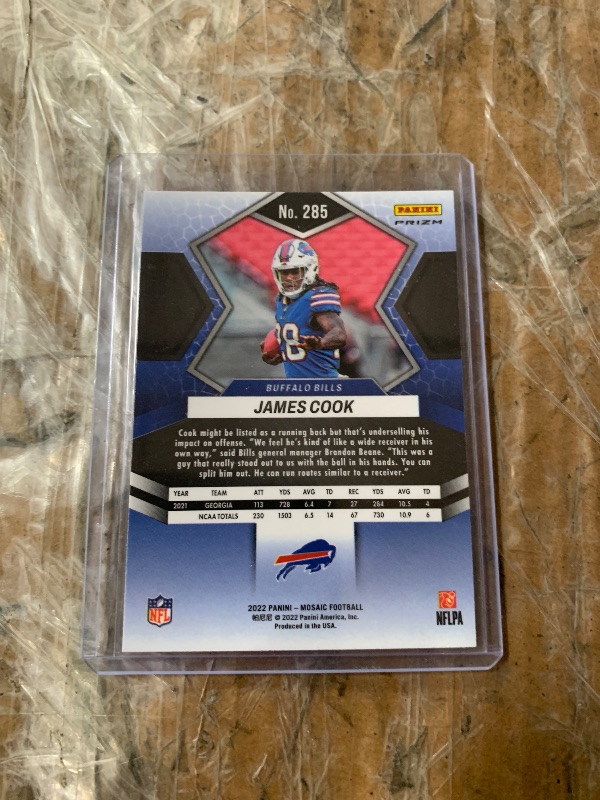 Photo 1 of James Cook Pink Camo Prizm #285 2022 Panini Mosaic (RC)