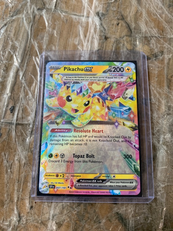 Photo 1 of Pikachu RC - 057/191 - SV08: Surging Sparks (SSP) Pokémon Training Cards