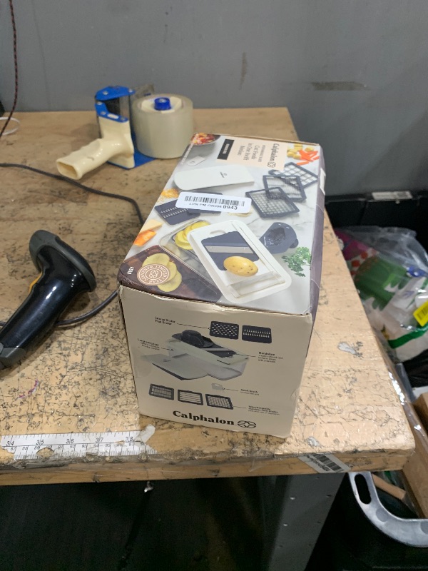 Photo 1 of **CONTAINER IS CRACKED BUT ALL ATTACHMENTS ARE INCLUDED** Calphalon Vegetable Chopper With Container, 3 Blades with1 Chopper and1 Mandoline, 5-in-1 Food Chopper with Stainless Steel Blades & Mandoline Slicer, Multi-Functional Dicer with Storage Container