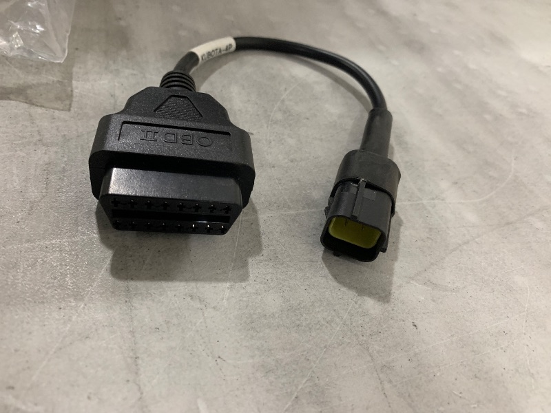 Photo 1 of  OBD2 diagnostic adapter cable, specifically one designed for Kubota industrial or agricultural equipment