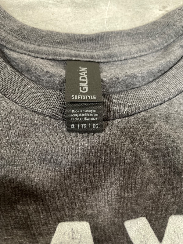 Photo 1 of "RETIRED" acronym shirt is a custom-printed design often found on Gildan Softstyle blanks. While the exact combination of words shown—Relax, Enjoy, Travel, Indulge, Reflect, Explore, Dream—is commonly used in customized retirement gifts----X-Large