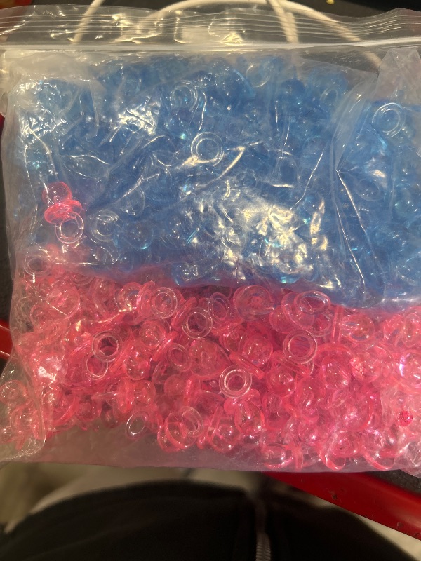 Photo 1 of ** pink and blue** XINHUIDALSQ 150 Mini Acrylic Pacifiers for Baby Shower Game, 0.86 Inch Bulk Chupones para Gender Reveal Party Favors Table Decoration (Pink)