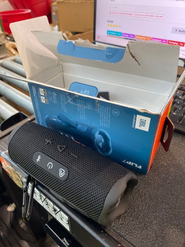 Photo 1 of ***BLACK*** JBL Flip 7 - Portable Waterproof and Drop-Proof Speaker, Bold JBL Pro Sound with AI Boost, 16Hrs of Playtime, and PushLock System with Interchangeable Accessories (Black)