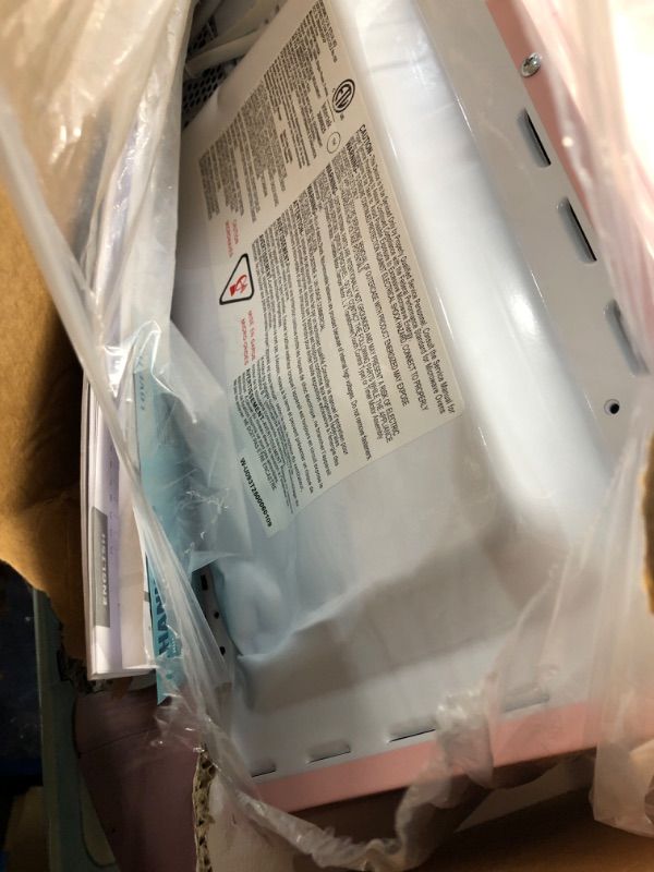 Photo 1 of **BACK IS DENTED*SOLD FOR PARTS* Nostalgia Retro 1000W Microwave Oven 1.1 Cu Ft Capacity – Child Safety Lock, 8 Auto-Cook Settings – Countertop Kitchen Appliance – Pink