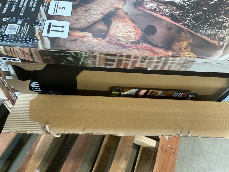 Photo 1 of ***DAMAGED BACK PANEL*** Masterbuilt® 40-inch Digital Electric Vertical BBQ Smoker with Leg Kit, Side Wood Chip Loader and 970 Cooking Square Inches in Black, Model MB20070122