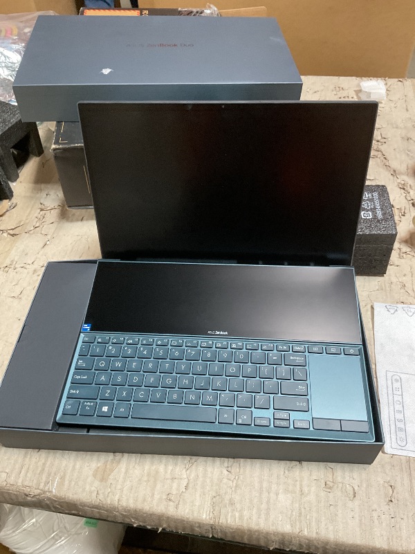Photo 1 of *FOR PARTS ONLY/ DOES NOT POWER ON* ASUS ZenBook Duo 14 UX482 14” FHD NanoEdge Touch Display, Intel Core i7-1165G7 CPU, NVIDIA GeForce MX450, 32GB RAM, 1TB SSD, Innovative ScreenPad Plus, Windows 10 Pro, Celestial Blue, UX482EG-XS77T laptop does not work.