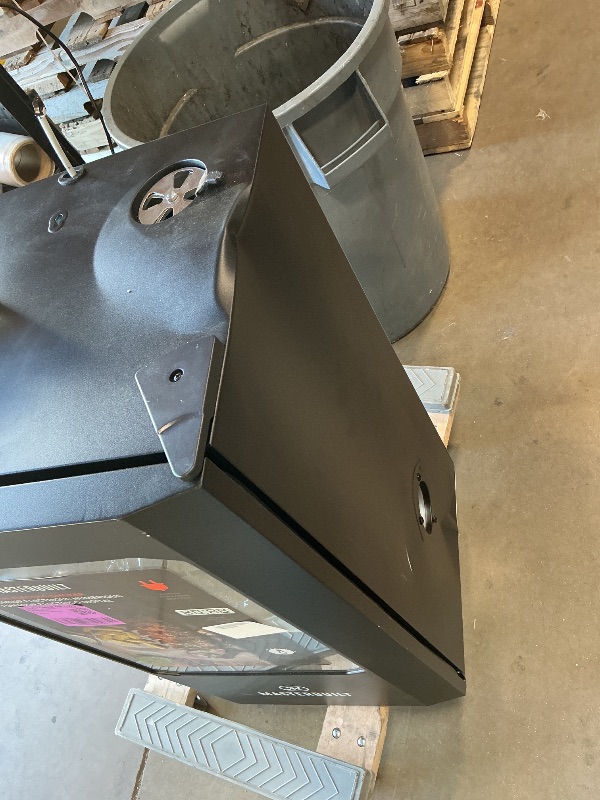 Photo 1 of ***MINOR DENT ON TOP***Masterbuilt® 30-inch Digital Electric Vertical BBQ Smoker with Leg Kit, Side Wood Chip Loader and 710 Cooking Square Inches in Black, Model MB20070421
