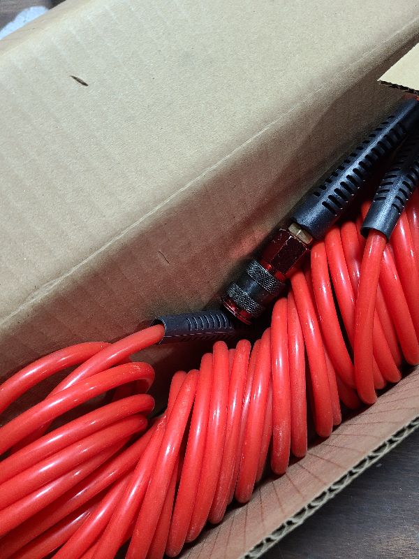 Photo 1 of 1/4 in x 25 ft Polyurethane Recoil Air Hose with Bend Restrictors Compressor Hose with 1/4" Industrial Universal Quick Coupler and I/M Plug Kit, Red
