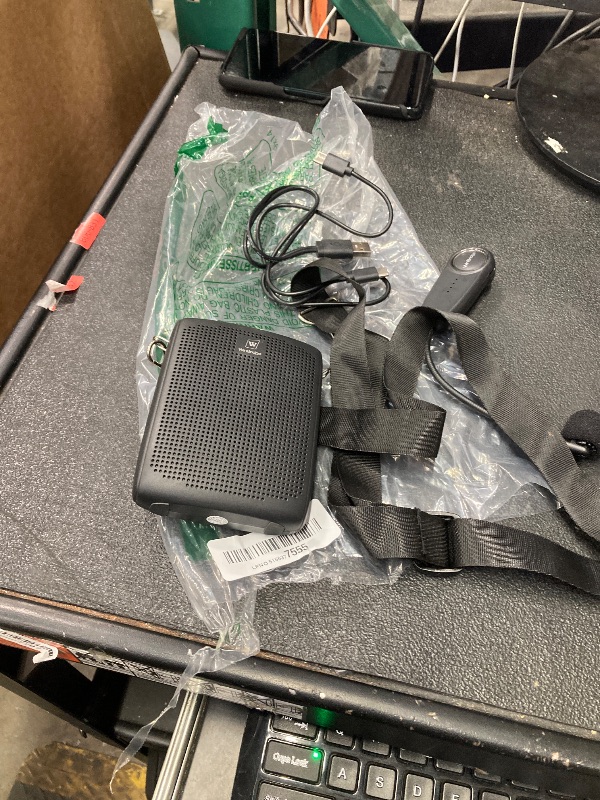 Photo 1 of  WinBridge WB002 Wireless Voice Amplifier. This portable device is designed to amplify your voice clearly and effectively, making it ideal for teachers, tour guides, coaches, presenters, and anyone who needs to project their voice to a group. Its lightwei
