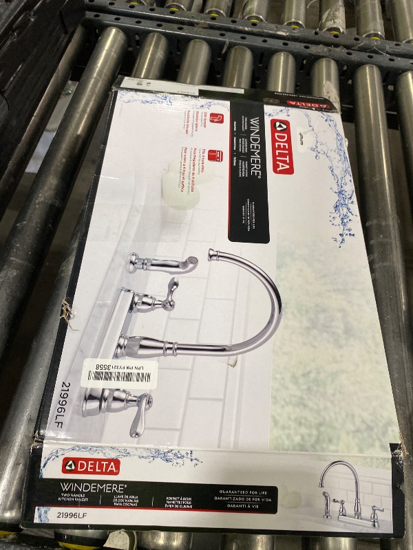 Photo 1 of Delta Windemere Chrome Kitchen Faucet with Side Sprayer, Traditional 4 Hole Kitchen Sink Faucet, Two-Handle, Chrome 21996LF