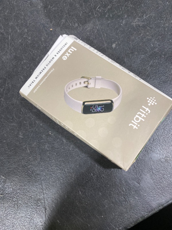 Photo 1 of Fitbit Luxe Soft Gold Stainless Steel Case & Lunar White Band