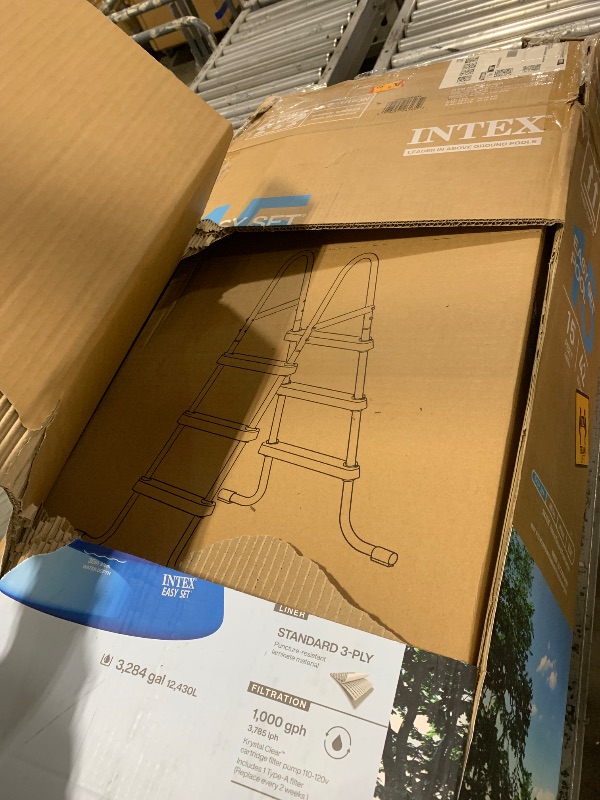 Photo 1 of Intex Easy Set 15 ft x 42in Above Ground Pool Set, Round Inflatable Swimming Pool with 1000 GPH Cartridge Filter Pump, Ladder, Cover, & Ground Cloth