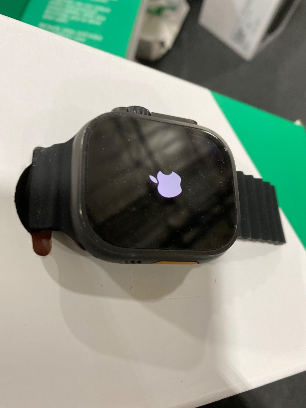 Photo 1 of Apple Watch Ultra 2 (GPS + Cellular, 49MM) - Black Titanium Case with Black Ocean Band (Renewed Premium)