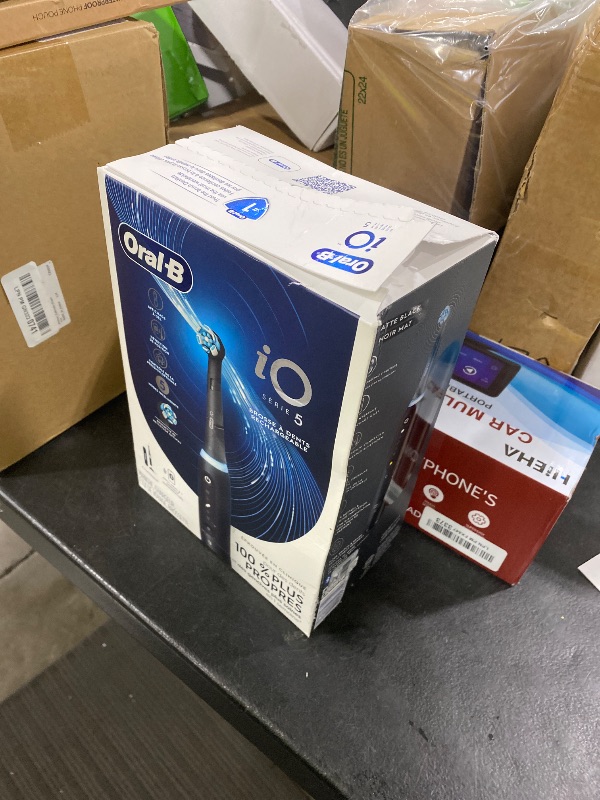 Photo 1 of Oral-B Rechargeable Electric Toothbrush, iO5 Customizable Clean, 5 Cleaning Modes, Visual Pressure Sensor to Protect Gums, Travel Case, Black
