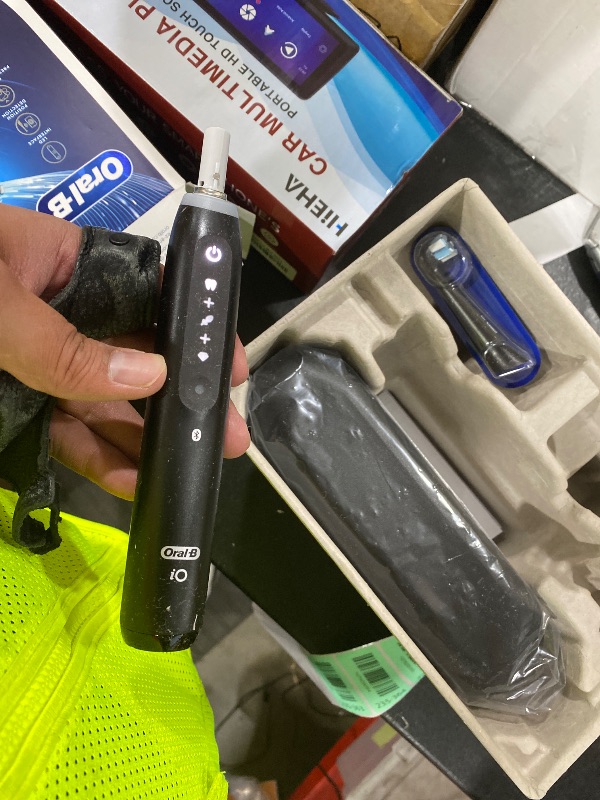 Photo 1 of Oral-B Rechargeable Electric Toothbrush, iO5 Customizable Clean, 5 Cleaning Modes, Visual Pressure Sensor to Protect Gums, Travel Case, Black