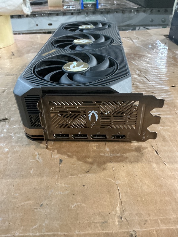 Photo 1 of ***POTENTIAL PARTS ONLY - REPORTED TO NOT BOOT***
ZOTAC GeForce RTX 5090 Solid OC Graphics Card, NVIDIA, 32GB GDDR7, DLSS 4, 3× DisplayPort 2.1b & HDMI 2.1b, PCIE 5.0 (ZT-B50900J-10P)
