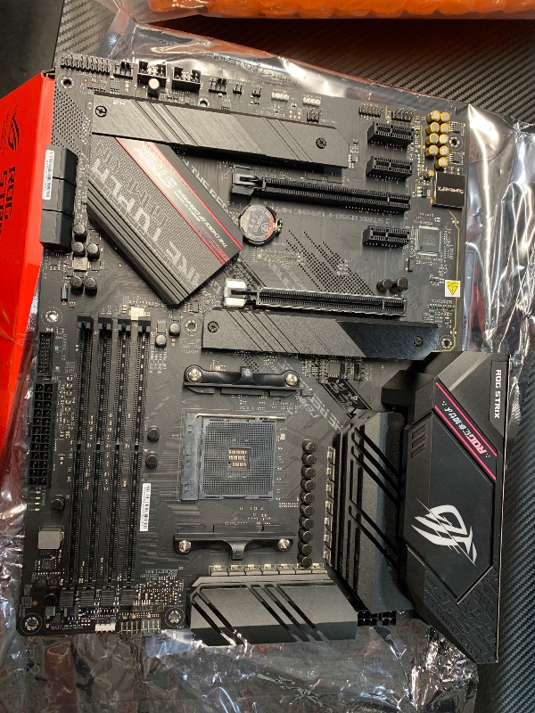 Photo 1 of *** COVER TO CPU IS BROKEN***
Asus ROG Strix B550-F Gaming WiFi II AMD AM4 (3rd Gen Ryzen) ATX Gaming Motherboard (PCIe 4.0,WiFi 6E, 2.5Gb LAN, BIOS Flashback, HDMI 2.1, Addressable Gen 2 RGB Header and Aura Sync)