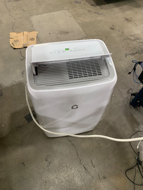 Photo 1 of **BLOWS HOT AIR** Garvee 14000Btu Portable Air Conditioner with Cooling/Dehumidify/Fan Mode Cools up to 750 Sq.Ft, 3 in-1 Quiet Portable AC Unit 3 Speed, Auto Swing, 24H Timer for Large Room