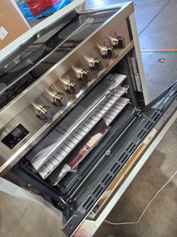 Photo 1 of ***FACTORY SEALED - OPENED FOR INPSECTION******TRUCK/TRAILER PICKUP ONLY***
Rangaire RRE361TS 36" Electric Range Oven with Timer - Stainless Steel, Infrared Stove Burners, True Convection, Easy Reach Racks