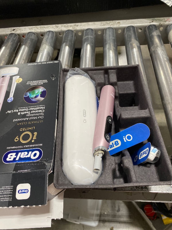 Photo 1 of Oral-B Rechargeable Electric Toothbrush, iO9 Limited Ultimate Clean, 7 Cleaning Modes, Interactive Display, iSense Charger, Charging Travel Case, Visible Pressure Sensor, 3 Brush Heads, Rose Quartz