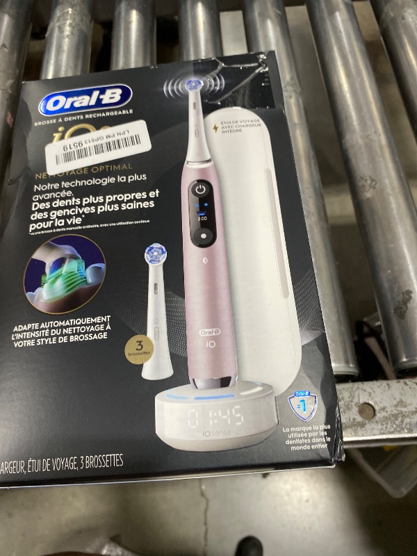 Photo 1 of Oral-B Rechargeable Electric Toothbrush, iO9 Limited Ultimate Clean, 7 Cleaning Modes, Interactive Display, iSense Charger, Charging Travel Case, Visible Pressure Sensor, 3 Brush Heads, Rose Quartz