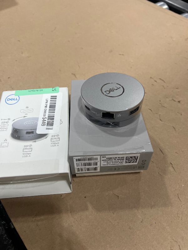 Photo 1 of Dell 7-in-1 USB-C Multiport Adapter - DA310-2. USB-A Ports, 1 USB-C, 1 HDMI, 1 DisplayPort, 1 VGA and 1 RJ-45 Port, Crisp 4K Resolution at 60Hz, SuperSpeed Data Transfers, Lightweight and Portable.