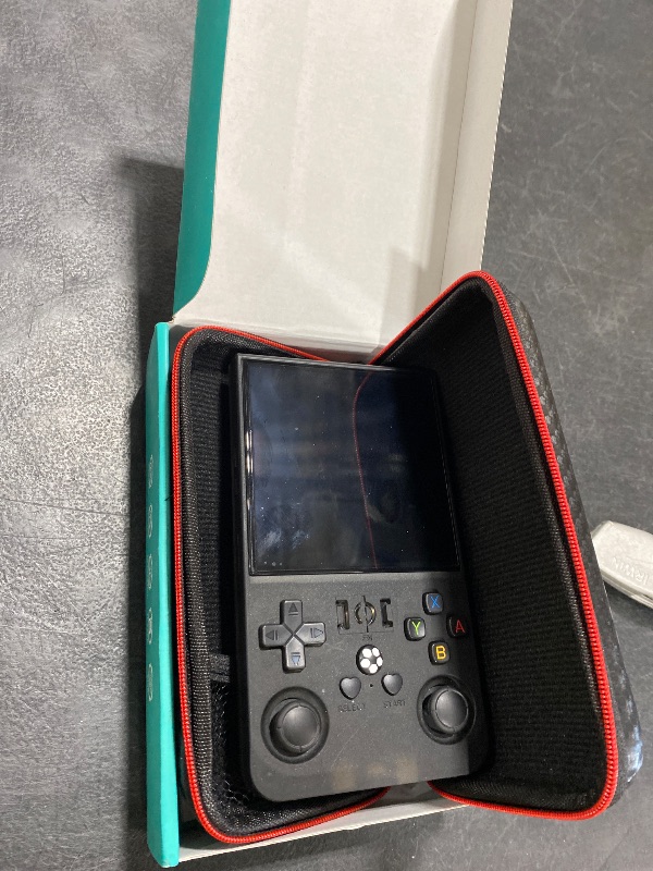 Photo 1 of R36MAX Retro Handheld Game Console,4.0 Inch Retro Gaming Console,Open Source Linux System Hand Held Game Console