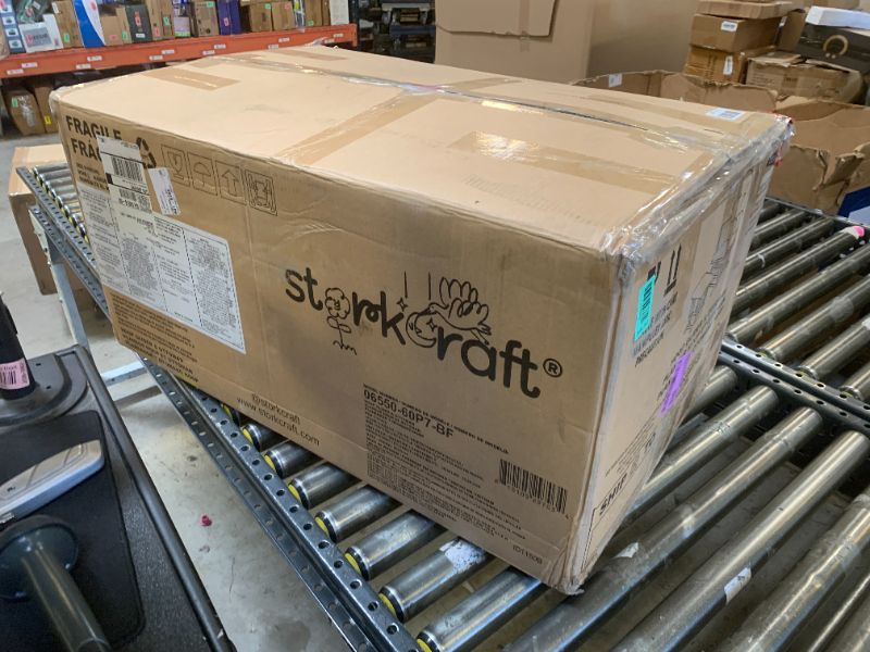 Photo 1 of Storkcraft Premium Hoop Glider & Ottoman - GREENGUARD Gold Certified, Solid Wood Craftsmanship, Convenient Storage Pockets, Nursery Rocking Chair, Multi-Award-Winning (Driftwood and Ivory Boucle)