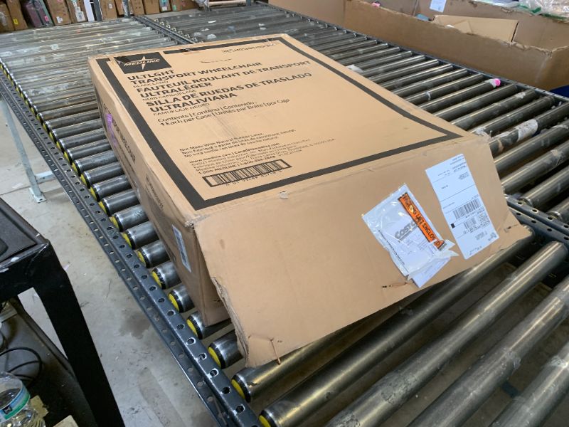 Photo 1 of Medline Lightweight Foldable Transport Wheelchair with Handbrakes and 12-Inch Wheels, Red Frame, Black Upholstery