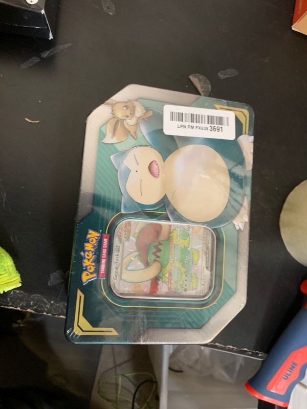 View 2 of **OPENED, INCOMPLETE, FAKES(?)**Pokemon Tag Team Tin Snorlax-GX & Eevee- TCG: Sun & Moon Box- 4 Booster Packs | 1 Special Eevee & Snorlax-GX Foil Card | Genuine Cards