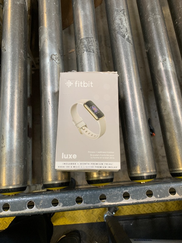 Photo 1 of Fitbit Luxe Soft Gold Stainless Steel Case & Lunar White Band