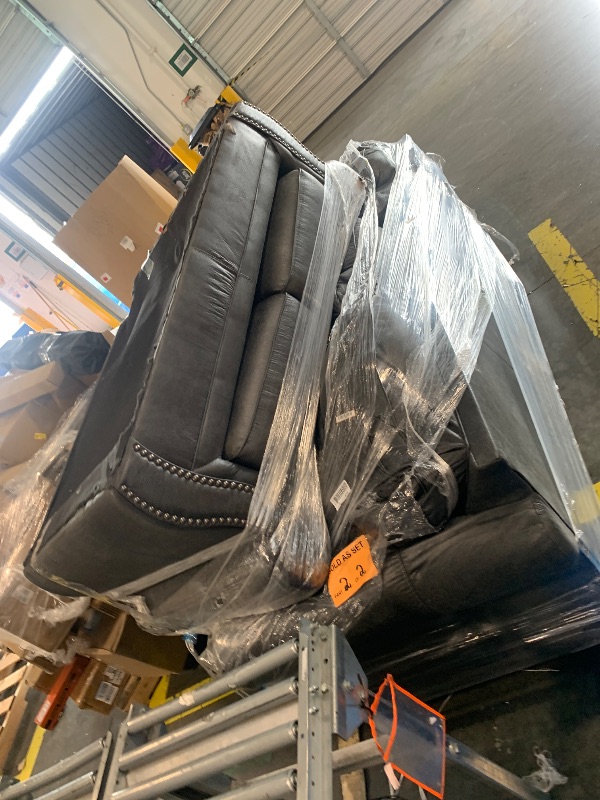 Photo 1 of *** BRING BIG TRUCK ITEM IS XL ON A PALLET *** Signature Design by Ashley Chatterton Rustic Faux Leather Loveseat with Nailhead Trim and 2 Throw Pillows, Reinforced Frame for Added Stability, Reversible Seat Cushions, Turned Legs, Dark Gray