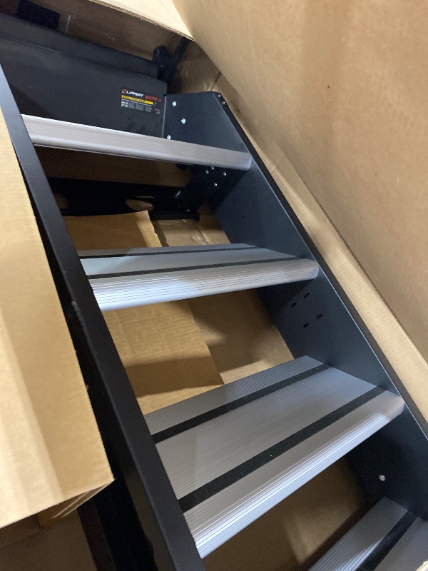 Photo 1 of Lippert Solid Step 4.0 Premium Quad RV Camper Entry Steps with Lift Assist Gas Struts, 26" Step Width, XL Top Tread, 8" Rise, 500-lb. Weight Capacity, Adjustable Legs, Recessed Feet - 2024057000