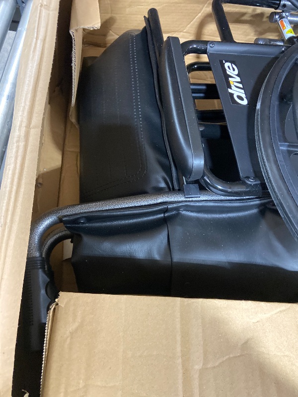 Photo 1 of Drive Medical SSP220DDA-ELR Silver Sport 2 Full-Reclining Transport Wheelchair with Detachable Desk Arms and Swing-Away Elevating Leg Rest, Black