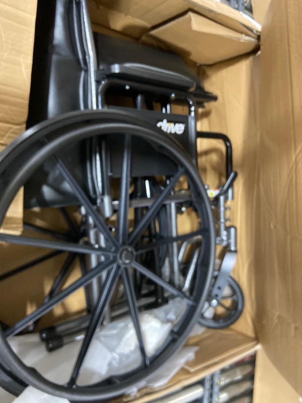 Photo 1 of Drive Medical SSP220DDA-ELR Silver Sport 2 Full-Reclining Transport Wheelchair with Detachable Desk Arms and Swing-Away Elevating Leg Rest, Black