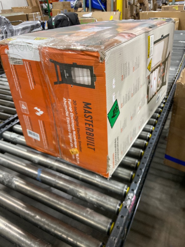 Photo 1 of Masterbuilt® 30-inch Digital Electric Vertical BBQ Smoker with Leg Kit, Side Wood Chip Loader and 710 Cooking Square Inches in Black, Model MB20070421