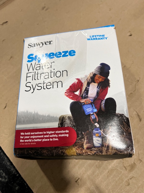 Photo 1 of Sawyer Products SP129 Squeeze Water Filtration System w/Two 32-Oz Squeeze Pouches, Straw, and Hydration Pack Adapter