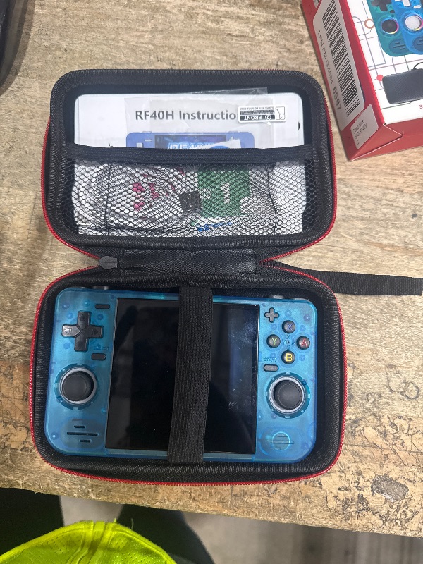 Photo 1 of ***Parts only*** RF40H Handheld Game Console, 4.0" Retro Gaming Console Preloaded 20,000+ Classic Games, Open Source Linux System, Support WiFi Online Play, Portable Pocket Hand Held Video Game (Transparent Blue)