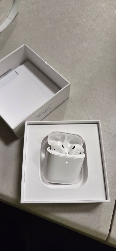 Photo 1 of Apple AirPods with Wireless Charging Case