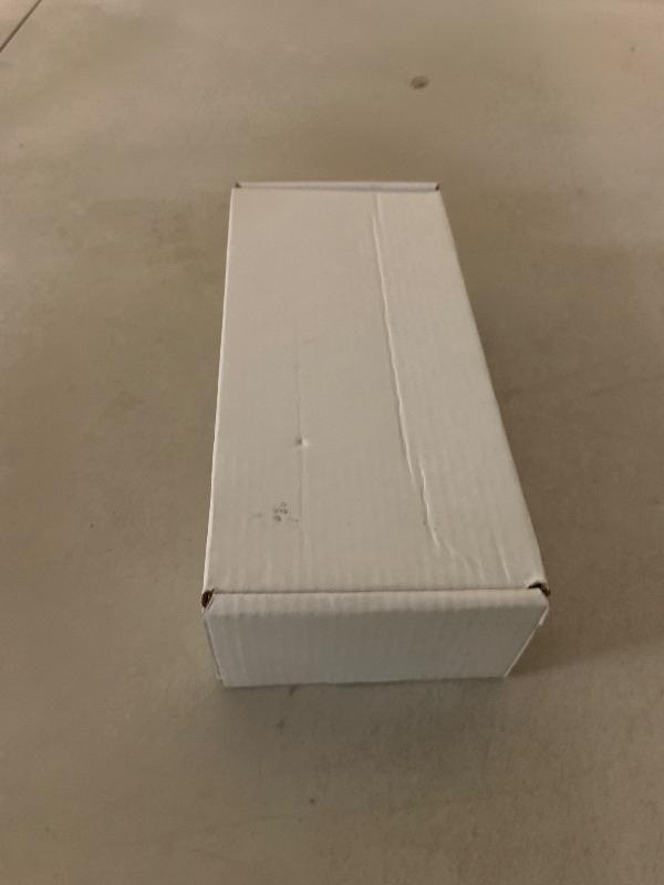 Photo 1 of Apple Watch Ultra 2 (GPS + Cellular, 49MM) - Black Titanium Case with Black Ocean Band (Renewed)