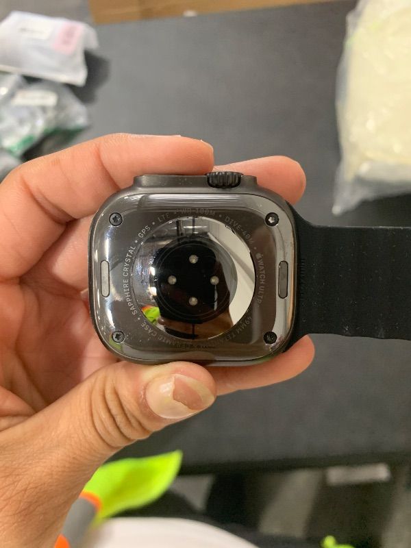 Photo 1 of Apple Watch Ultra 2 (GPS + Cellular, 49MM) - Black Titanium Case with Black Ocean Band (Renewed)