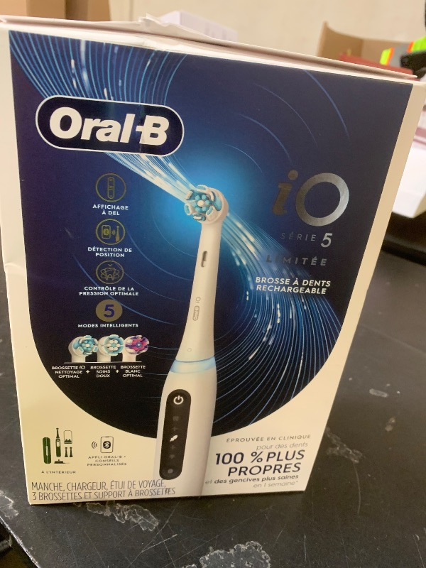 Photo 1 of Oral-B Rechargeable Electric Toothbrush, iO5 Limited Deep Clean & Whiten, 5 Cleaning Modes, Visual Pressure Sensor to Protect Gums, Travel Case, 3 Brush Heads, White