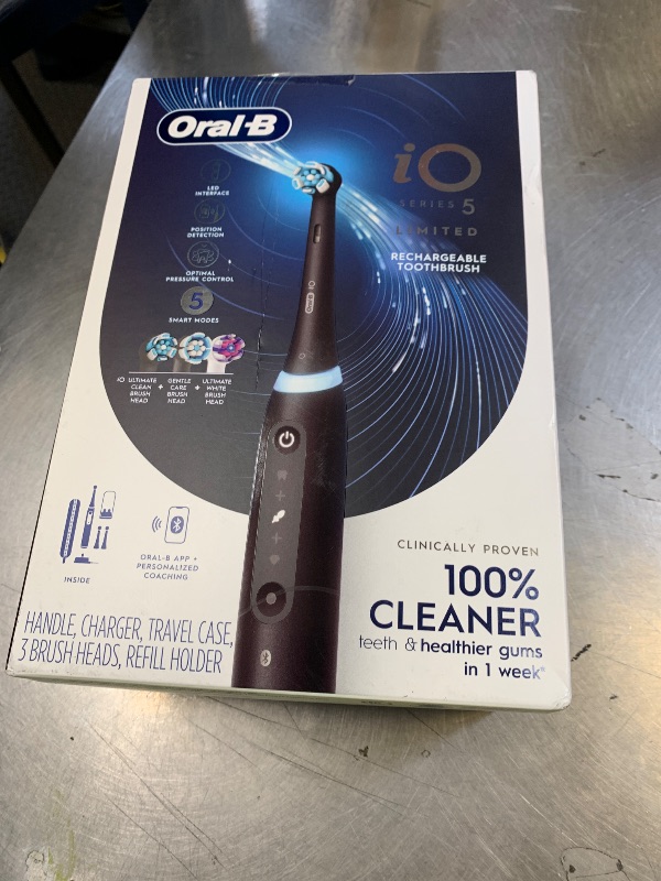 Photo 1 of Oral-B Rechargeable Electric Toothbrush, iO5 Limited Deep Clean & Whiten, 5 Cleaning Modes, Visual Pressure Sensor to Protect Gums, Travel Case, 3 Brush Heads, Black